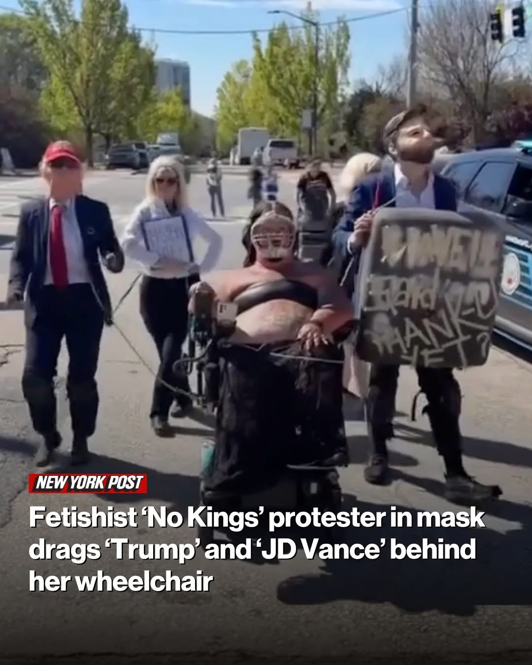 Fetishist ‘No Kings’ protester in mask drags ‘Trump’ and ‘JD Vance’ behind her wheelchair